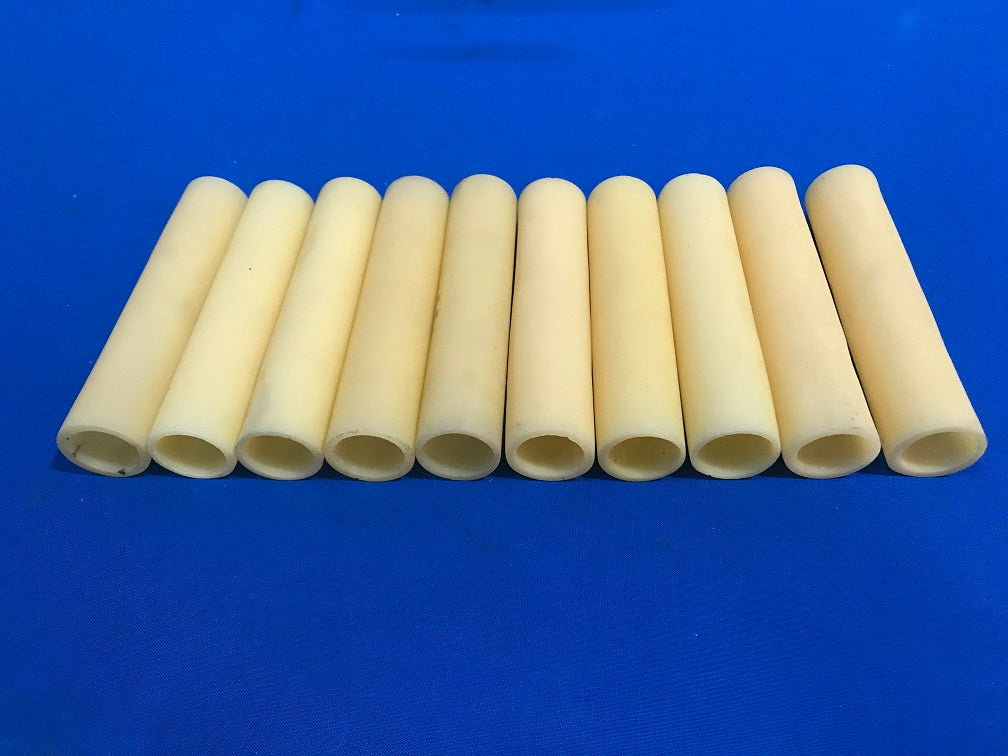 E-12 Candle sleeves 5" tall approximately 1.00 diameter and could be cut to a desired lenght,material is plastic,cream coloured. (sold in lot of 10pcs)